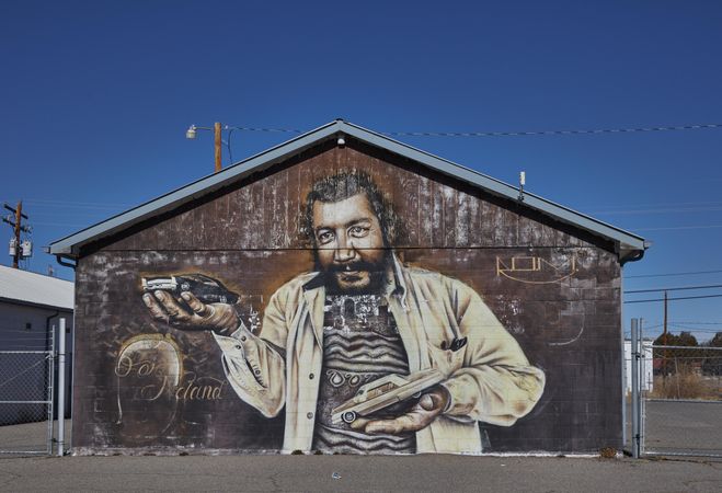 Mural by Randy Ortiz Martinez depicting iconic local lowrider Noland Martinez in Española, NM
