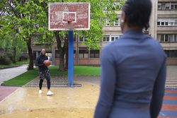 Active Lifestyle and Fitness: Friends Enjoying Basketball in Spring.