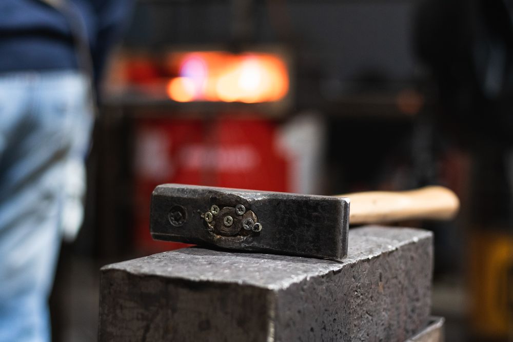 Hammer on workbench in blacksmith workshop