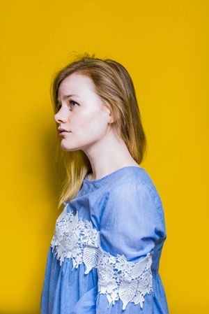 Blonde woman posing in studio