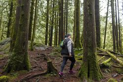 Mature woman exploring the woods
