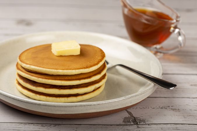 Delicious pancakes with butter and honey.