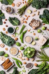Healthy vegan, plant based protein source and body building food, scattered on beige background