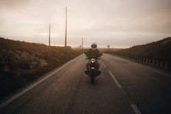 Motorcyclist on foggy road