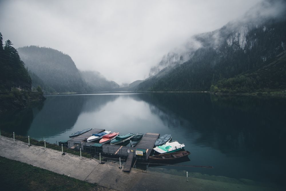 Dinghies on dock under cloudy sky