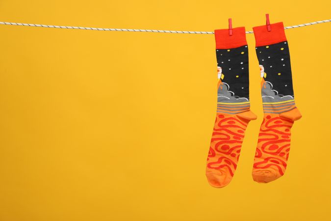 Casual clothes and wearing concept - socks, clothes for foot