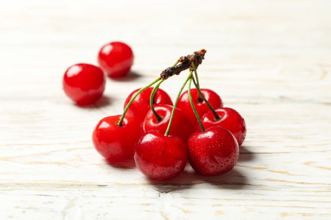 Fresh red cherry on wooden background, close up