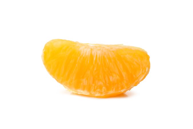 Piece of ripe mandarin isolated on light background