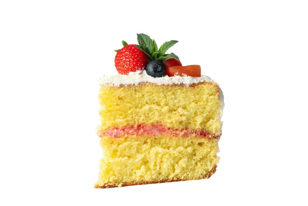 Piece of berry cream cake isolated on blank background