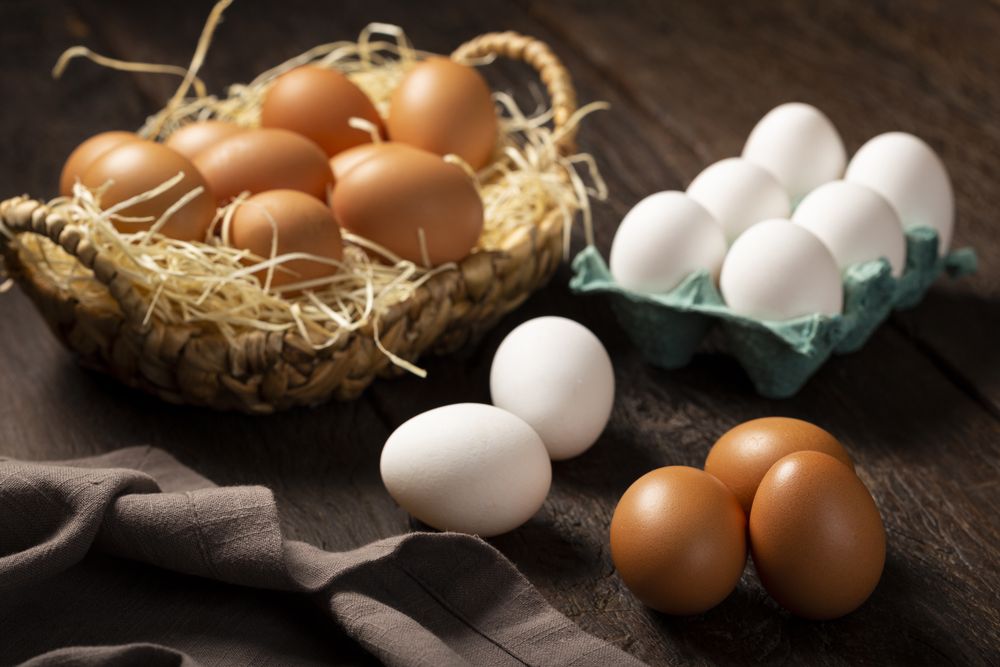 Chicken eggs go up on the table.
