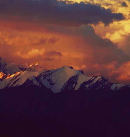Snow covered mountain during sunset in Tibet