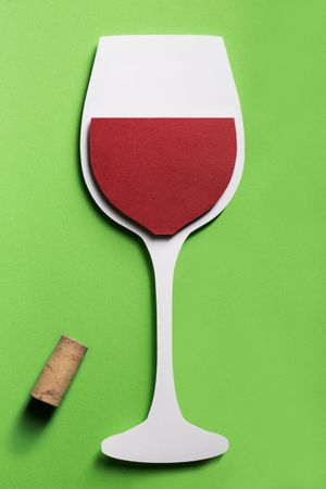 Silhouette of a glass of red wine made with cardboard
