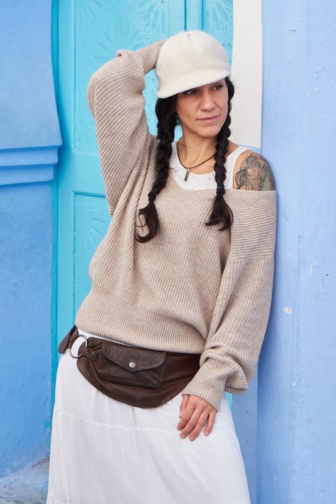 Smiling woman posing near vintage door