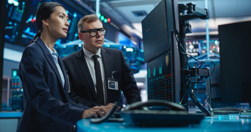 Team of Male and Female Traders Working in a Modern Stock Exchange Company.
