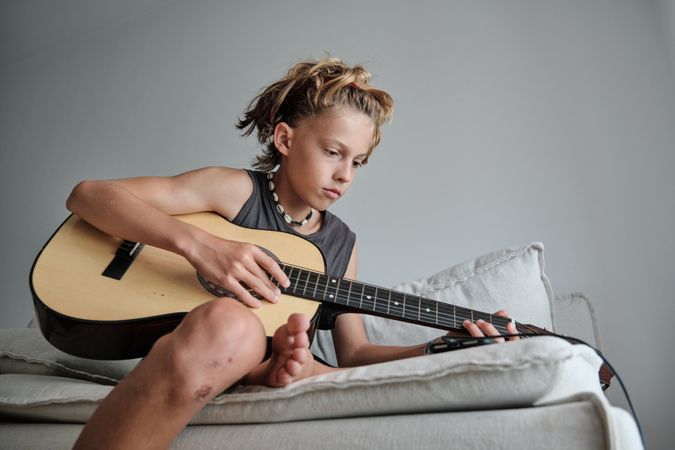Child playing the guitar