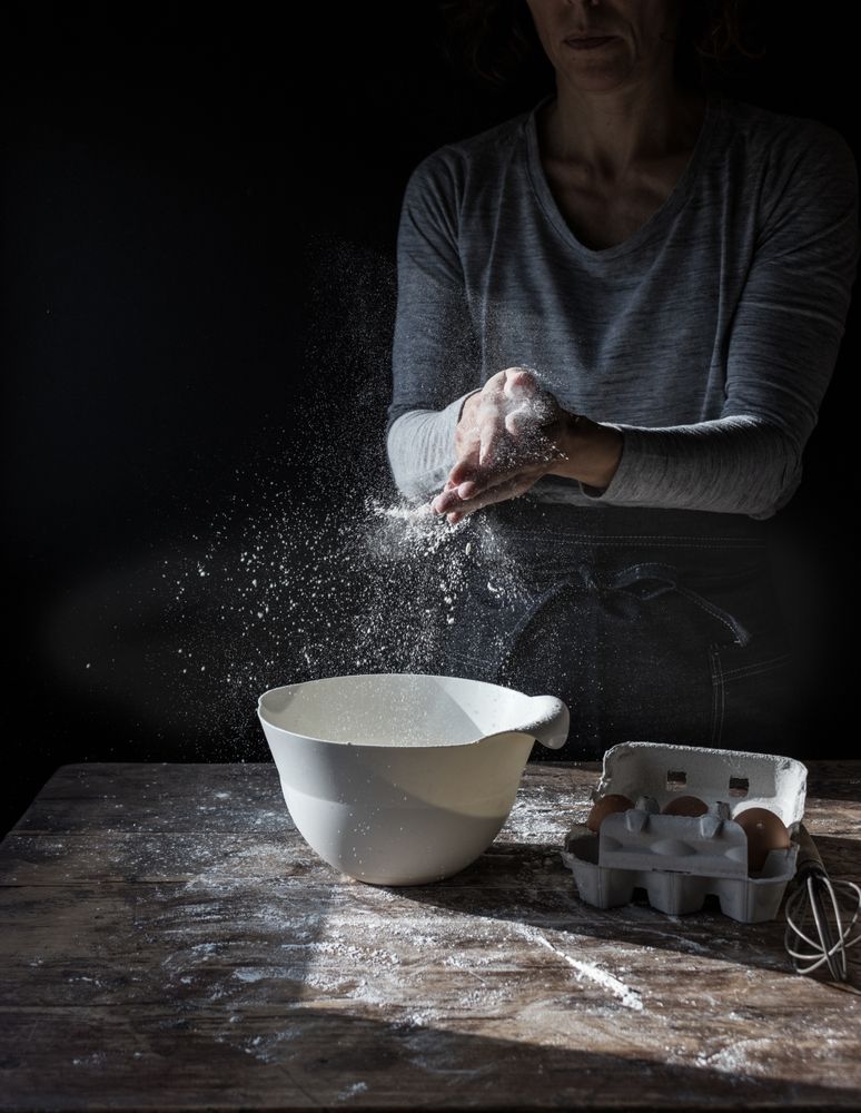Baker with flour and bowl