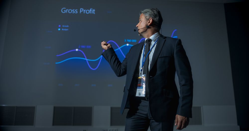 Successful Man Reporting On Revenue Growth and Business Objectives