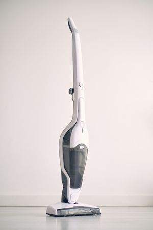 Contemporary vacuum cleaner placed on floor in apartment