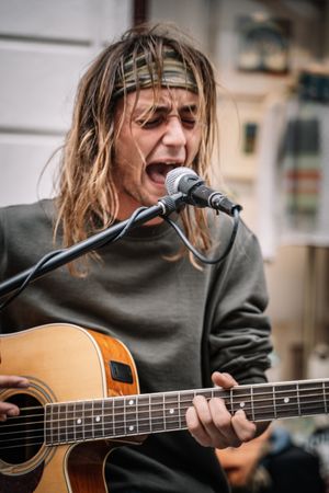 Male musician performing in the street