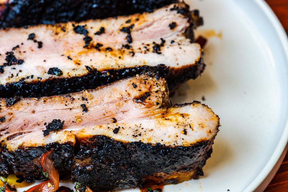 Close up of roasted pork meat with vegetables