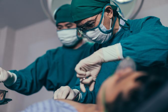 Surgery team working on patient in the theater