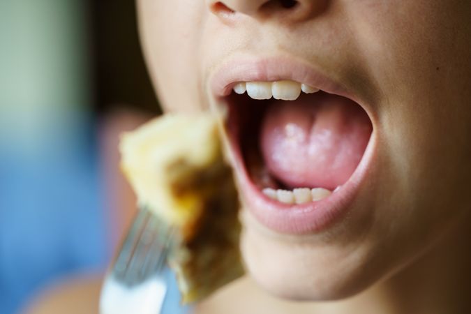 Teenager eating fritata