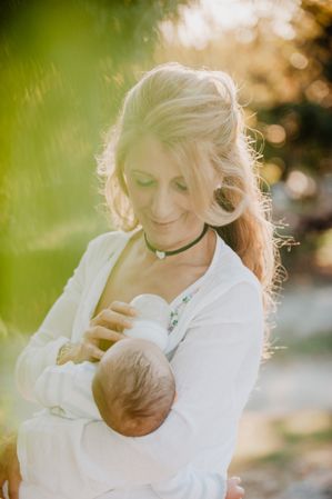 woman feeding a baby with a bottle