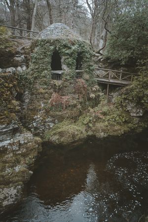 Stone shelter at riverside in Tollymore Forest Park