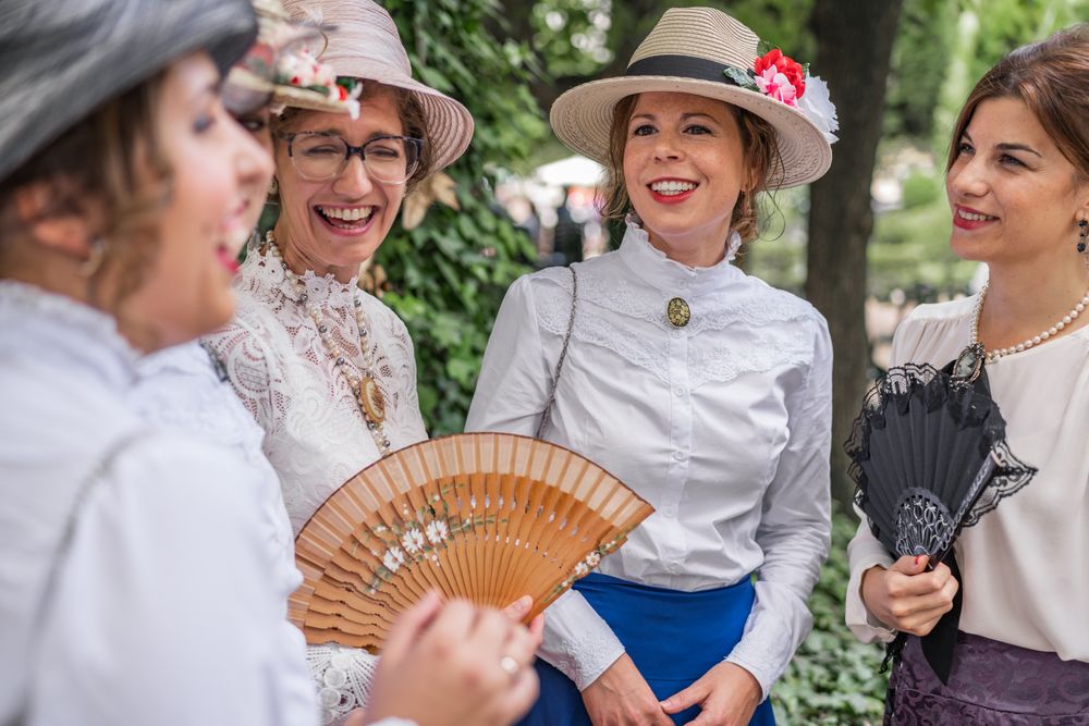 Vintage female friends speaking in garden