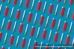 Red lighters and cigarettes on blue background 0VvLD0