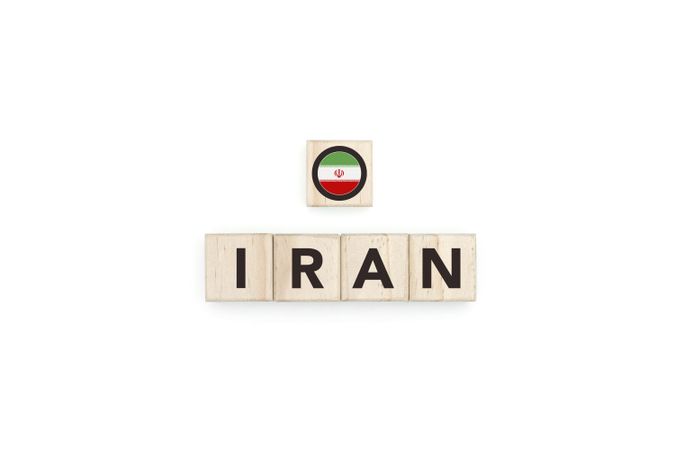 Wooden blocks bearing the name and flag of Iran.