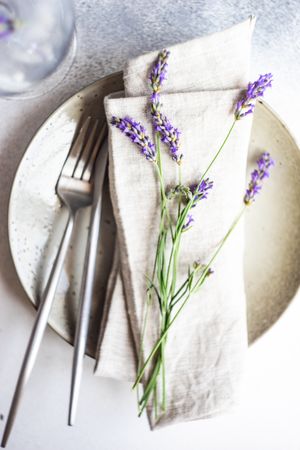 Top view of elegant summer table setting with lavender flowers