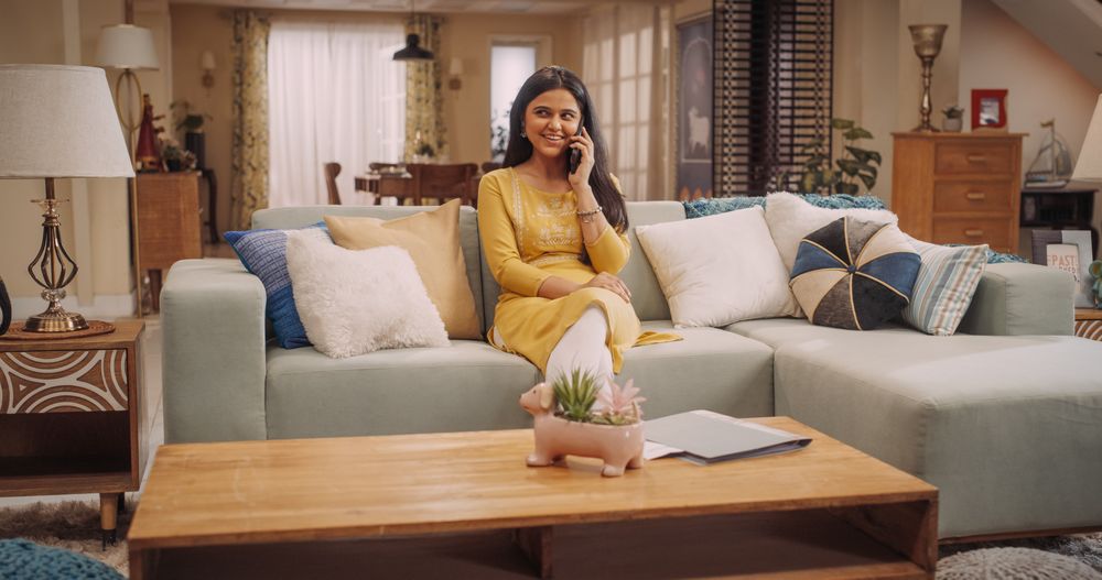 Indian Woman Engaged in a Lively Phone Call at Home