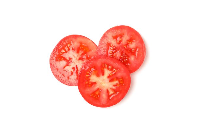 Slices of tasty tomato isolated on neutral background