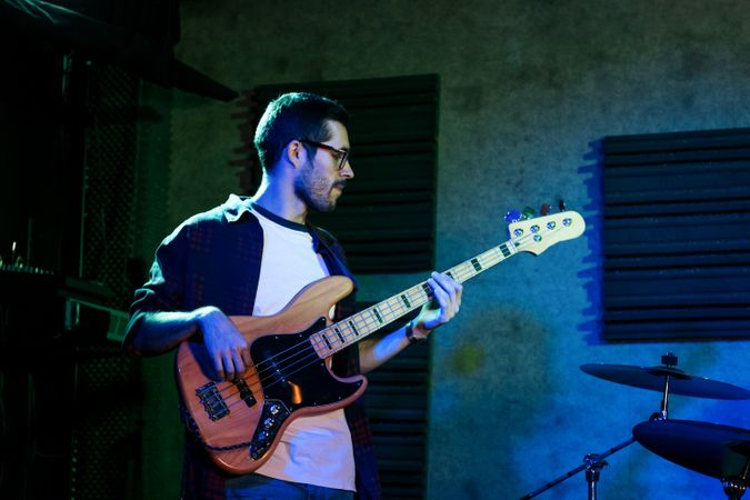 Bass Player In Stage With Colorful Lights