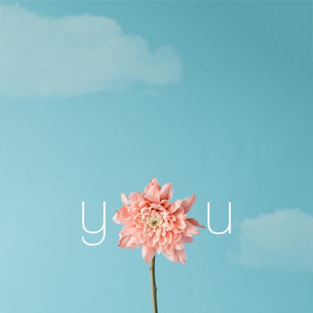 Pink flower on sky background making the word “you”