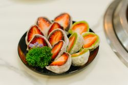Exquisite Cross-Section of a Japanese Strawberry Daifuku Showing its Mochi, Anko, and Fresh Fruit Layers