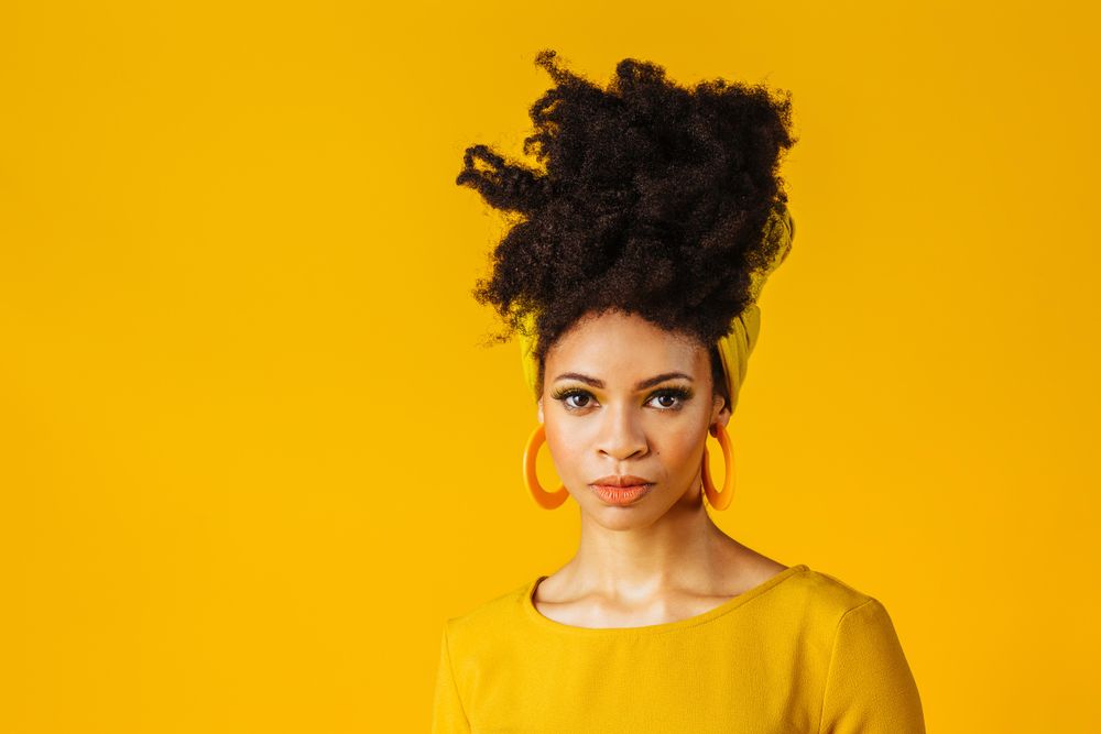Portrait of serious Black woman with large earrings