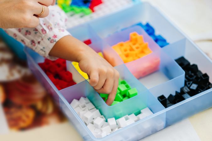 Box with colorful pieces for board game