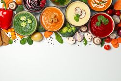 Colorful soups on top of picture with copy space