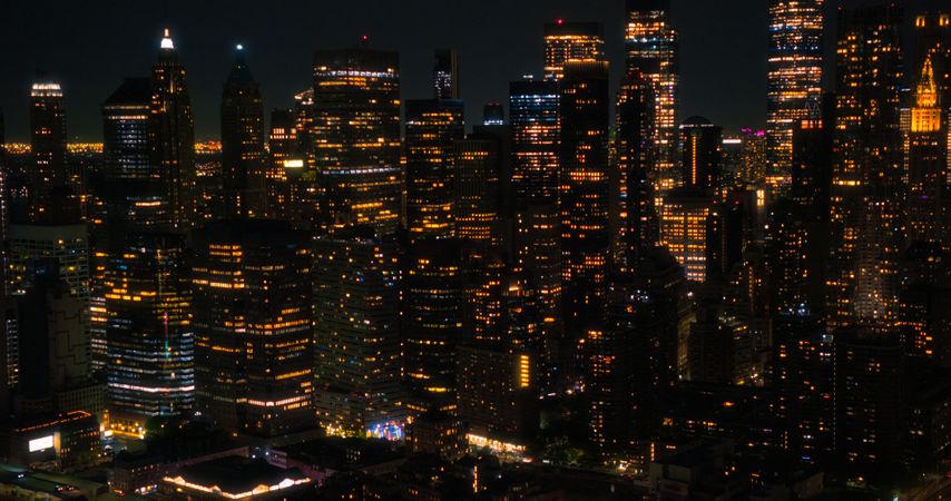 Helicopter Tourist Tour Around New York City at Night. Aerial View with a Picturesque Illuminated Office Buildings, Scenic View with Manhattan Skyscrapers Panorama