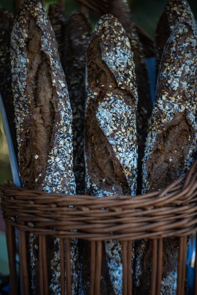 Golden rustic baguettes in basket