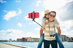 Cute couple taking a selfie near a river