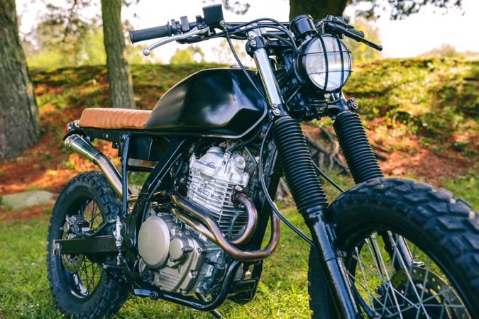 Custom motorcycle parked on the field