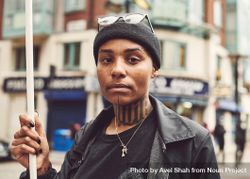 London, England, United Kingdom - June 6th, 2020: Tattooed woman holding sign 5oD9y4