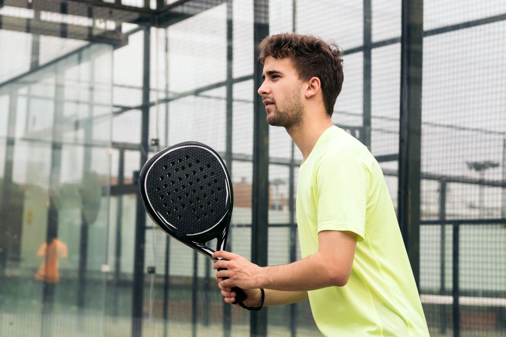 Young man ready to play paddle tennis