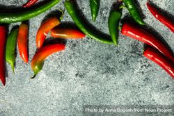Spicy peppers on grey counter with copy space bGRxjB