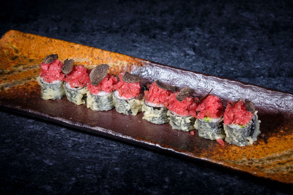 Tempura sushi rolls of tuna on plate