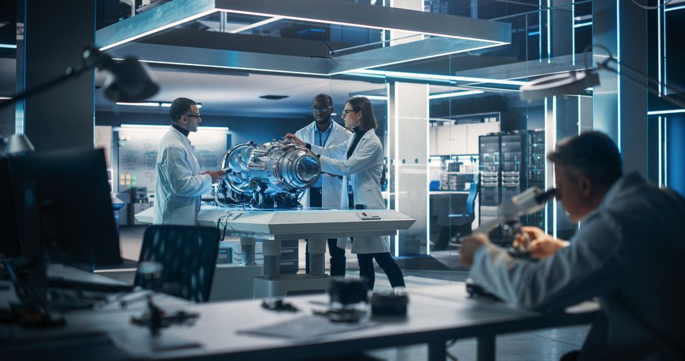 Thrust Engine Engineer, Project Manager and Machinery Operator Work on a Futuristic Turbine Motor