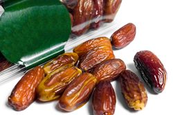 Dates fruit in plastic package with blank green label for product mockup design